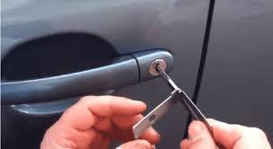 Automotive locksmith working on a car lock