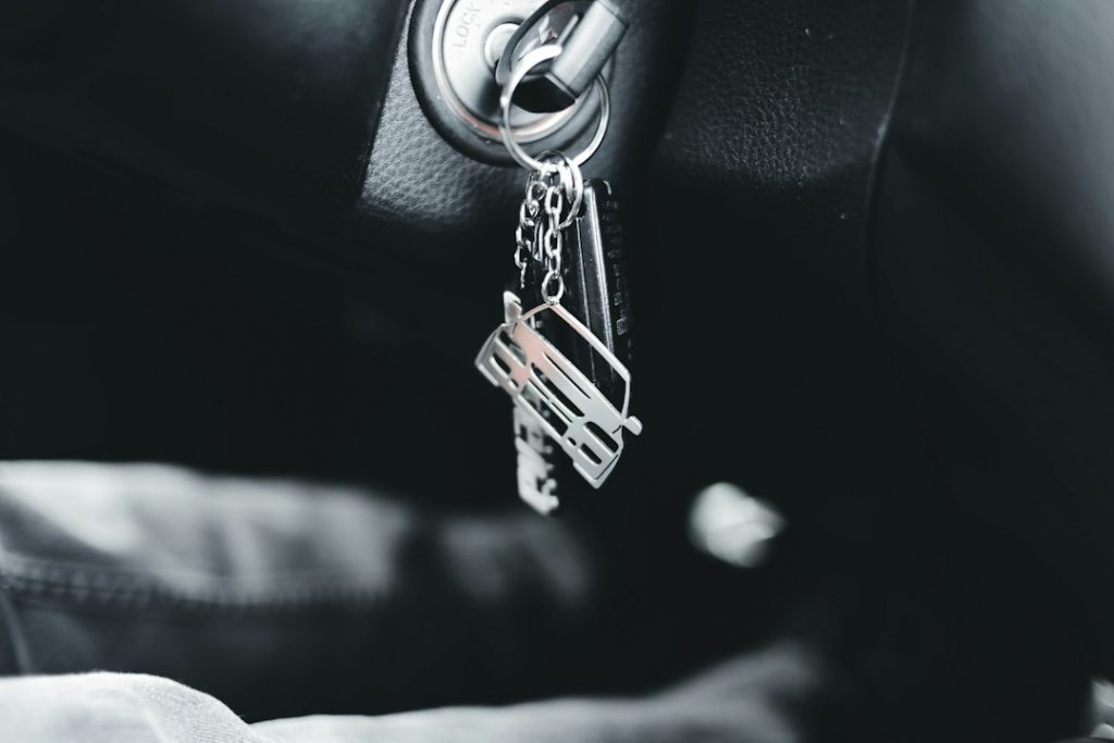 A car key inserted in a vehicle ignition.